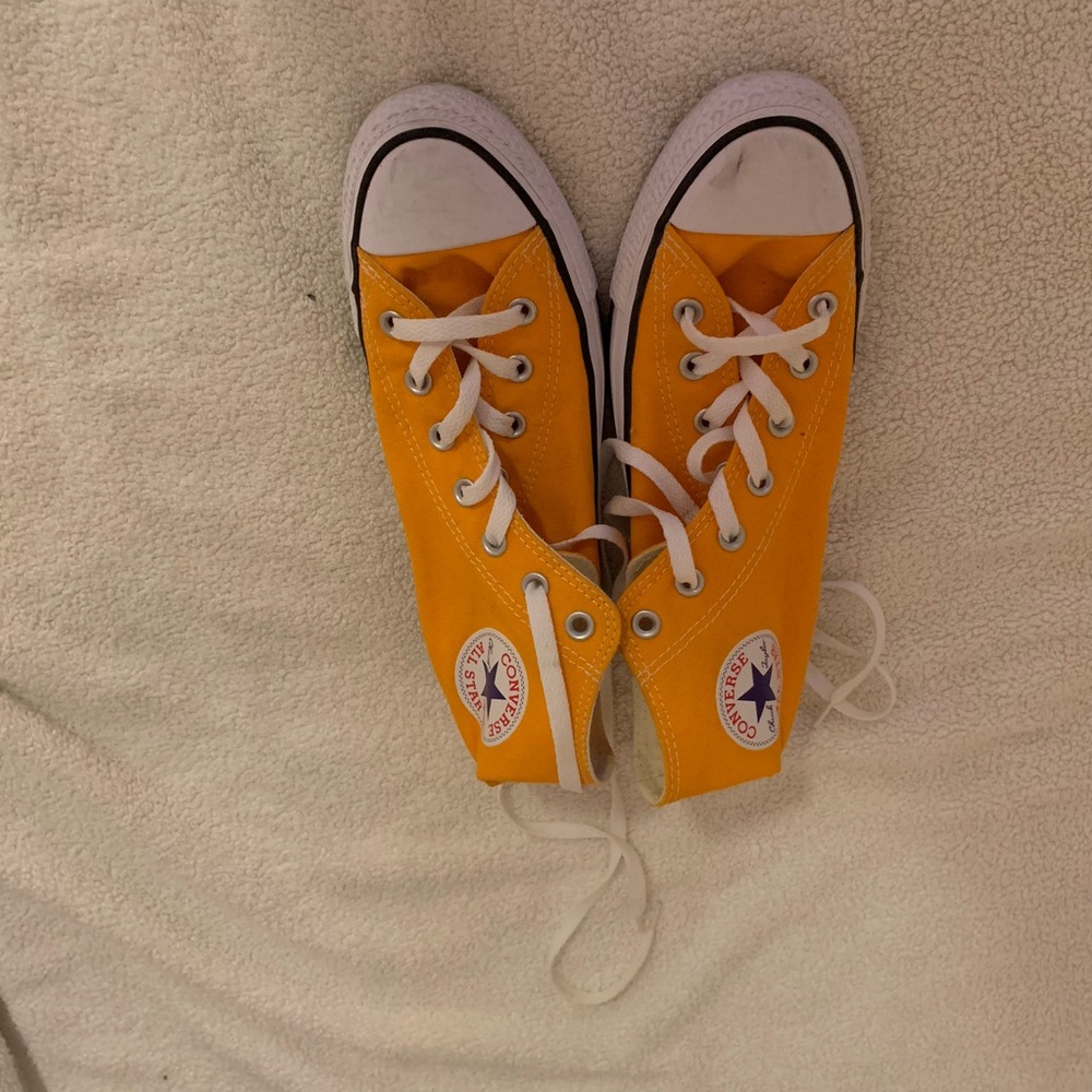 Bright orange high top converse